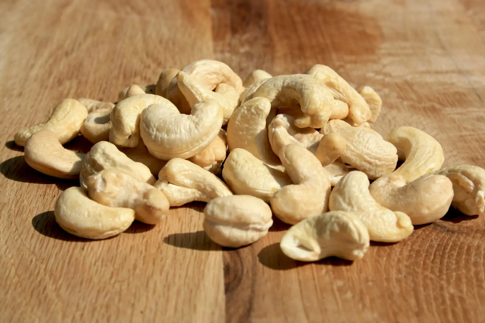 Cashew nuts on a wooden board