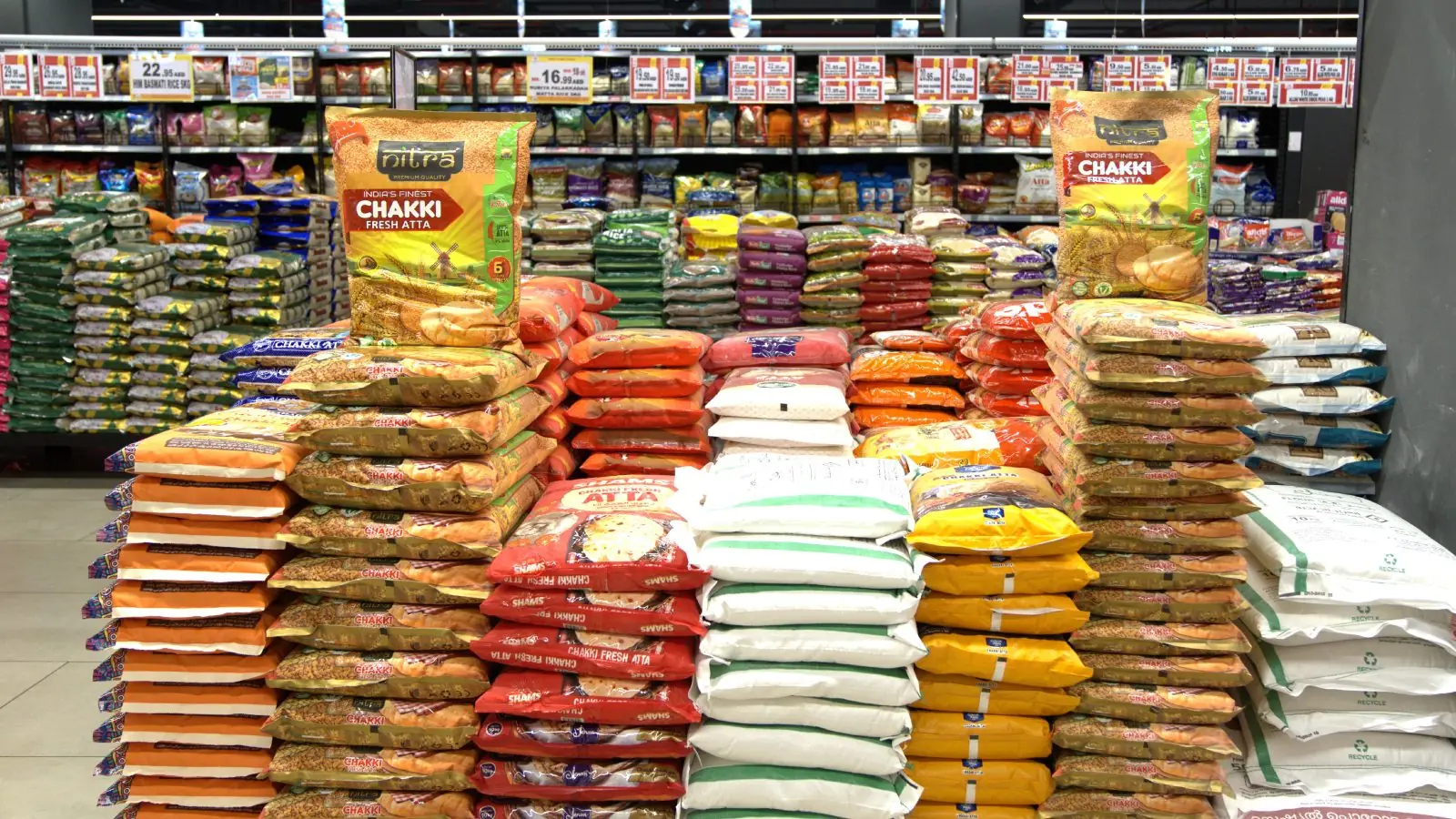 Nitra rice and atta packs stacked in a UAE supermarket