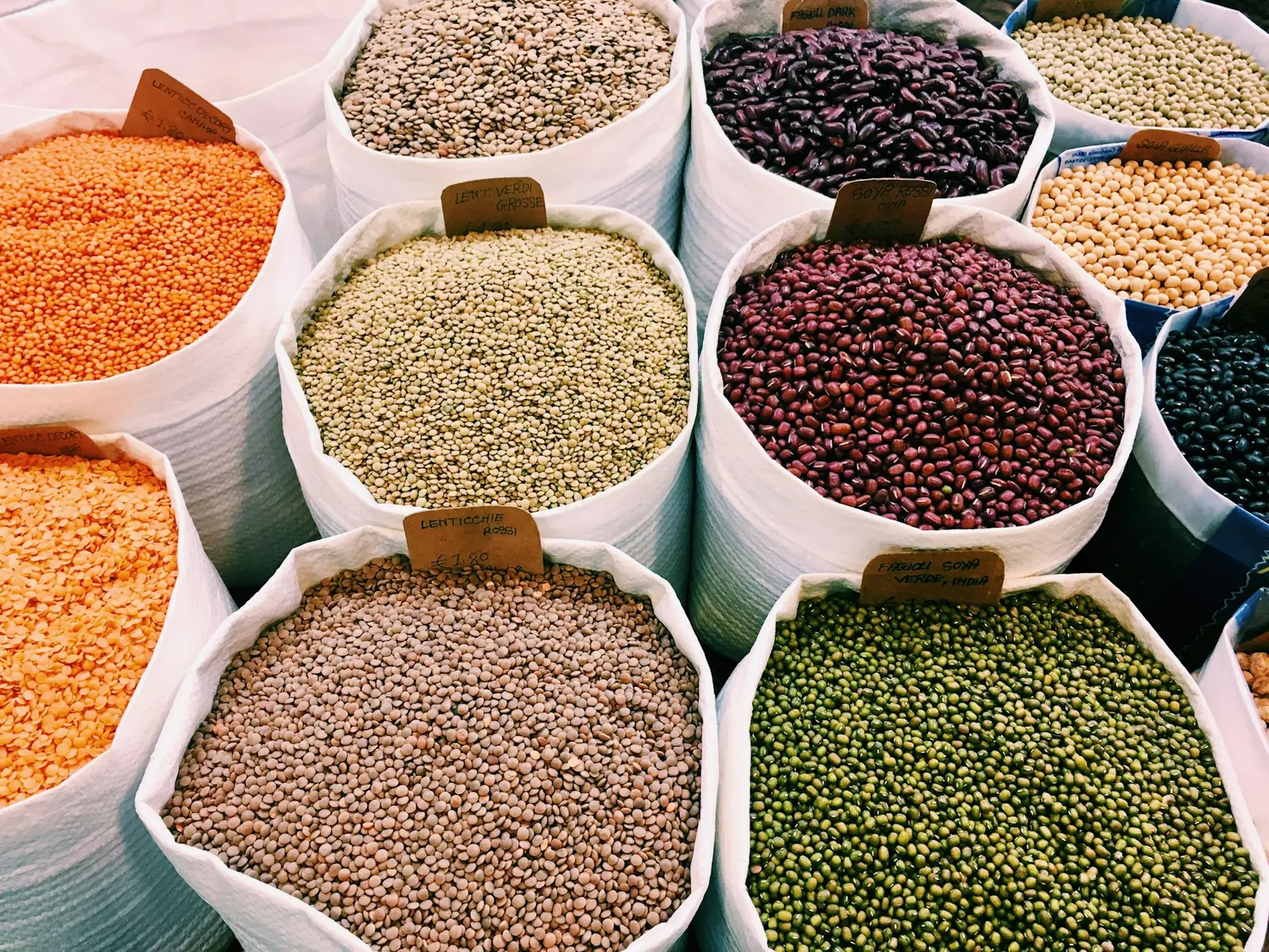 Open sacks of lentils, beans and pulses at a market